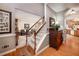Hallway with hardwood floors leading to the living room, dining room, and kitchen at 1394 Meadow Springs Dr, Lilburn, GA 30047