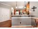 The kitchen features a breakfast bar with granite countertops and pendant lighting at 1394 Meadow Springs Dr, Lilburn, GA 30047