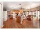 Bright kitchen with wood cabinets, hardwood floors, and a cozy breakfast nook with backyard views at 1394 Meadow Springs Dr, Lilburn, GA 30047