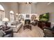 Cozy living room with a fireplace, built-in shelving, and abundant natural light at 1394 Meadow Springs Dr, Lilburn, GA 30047