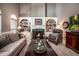 Cozy living room with fireplace, built-in shelves and a large window at 1394 Meadow Springs Dr, Lilburn, GA 30047