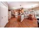 Open concept living space with wood flooring, breakfast nook and spacious kitchen at 1394 Meadow Springs Dr, Lilburn, GA 30047