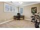 Cozy office area with desk, drums, carpet floors and natural light at 2187 Rando Ln, Atlanta, GA 30318