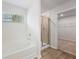 Bright bathroom with a large soaking tub, glass shower, and walk-in closet at 7158 Brushwood Bend (110), Lithonia, GA 30058