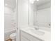 A clean bathroom features a white vanity, toilet, and shower-tub combination at 7158 Brushwood Bend (110), Lithonia, GA 30058