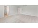 Bright bedroom featuring neutral carpet, a walk-in closet, and freshly painted walls at 7158 Brushwood Bend (110), Lithonia, GA 30058