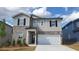 Charming two-story home with brick and siding, complemented by a well-manicured front yard at 7158 Brushwood Bend (110), Lithonia, GA 30058