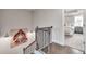 Hallway with wooden stair railing and a view of a bedroom at 1729 Lansmere Sw St, Marietta, GA 30008