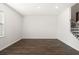 A bright, empty room with hardwood floors and a staircase at 1729 Lansmere Sw St, Marietta, GA 30008