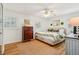 Cozy bedroom with hardwood floors and a ceiling fan for added comfort at 2528 Fernleaf Nw Ct, Atlanta, GA 30318