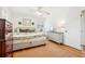 Sunlit bedroom featuring hardwood floors, with a view of the backyard at 2528 Fernleaf Nw Ct, Atlanta, GA 30318