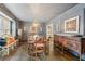 Elegant dining room with rich wood floors, wainscoting, and stylish decor for sophisticated gatherings at 2528 Fernleaf Nw Ct, Atlanta, GA 30318