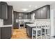 Modern kitchen with gray cabinets, stainless steel appliances, and bright white countertops at 2528 Fernleaf Nw Ct, Atlanta, GA 30318