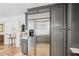 Kitchen refrigerator has stainless steel finish, and is surrounded by tall gray cabinets at 2528 Fernleaf Nw Ct, Atlanta, GA 30318