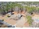 Aerial view of the property featuring the house, the surrounding lush greenery, and the neighborhood at 30 Magnolia Dr, Oxford, GA 30054