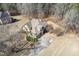 Aerial view of a landscaped home featuring a private driveway and mature landscaping at 30 Magnolia Dr, Oxford, GA 30054