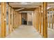 Unfinished basement space with wooden frame showcases potential for customization and expansion at 30 Magnolia Dr, Oxford, GA 30054