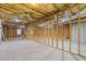 Spacious unfinished basement features insulation, framing, and visible ductwork, ready for customization at 30 Magnolia Dr, Oxford, GA 30054