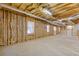 Large unfinished basement with exposed insulation and ductwork, providing ample space for future development at 30 Magnolia Dr, Oxford, GA 30054