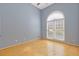 Bright bedroom with hardwood floors, neutral walls, and a large window providing ample natural light at 30 Magnolia Dr, Oxford, GA 30054