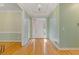 Warm foyer with gleaming hardwood floors, light-colored walls, and a welcoming front door at 30 Magnolia Dr, Oxford, GA 30054