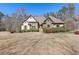 Charming home featuring stone and stucco exterior accents, beautiful landscaping, and a welcoming front entrance at 30 Magnolia Dr, Oxford, GA 30054