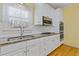 Well-equipped kitchen featuring stainless steel appliances and granite countertops at 30 Magnolia Dr, Oxford, GA 30054