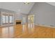 Spacious living room with hardwood floors, fireplace, and beautiful natural lighting at 30 Magnolia Dr, Oxford, GA 30054