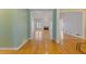 Elegant living room showcasing beautiful hardwood floors, a fireplace, and lots of natural light at 30 Magnolia Dr, Oxford, GA 30054