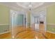 Spacious living space featuring hardwood floors, light walls, and open doorways leading to other rooms at 30 Magnolia Dr, Oxford, GA 30054