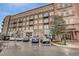 Modern apartment exterior featuring brick facade, balconies, and street parking at 505 Rocking Porch Way Way, Woodstock, GA 30189