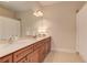 Bathroom featuring a double vanity, granite counters, and a large mirror at 505 Rocking Porch Way, Woodstock, GA 30189