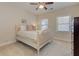 Bedroom featuring a comfortable bed, bright windows, and neutral-toned carpet with lots of space at 505 Rocking Porch Way Way, Woodstock, GA 30189