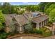 Aerial view of the clubhouse featuring gray shingles and stunning architectural details with the surrounding community at 505 Rocking Porch Way, Woodstock, GA 30189