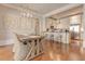 Elegant dining room showcasing a modern chandelier and a view into the gourmet kitchen at 505 Rocking Porch Way Way, Woodstock, GA 30189