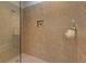 Tile shower stall with shower head, a built in niche and glass partition at 505 Rocking Porch Way, Woodstock, GA 30189