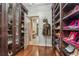 This walk-in closet features shoe shelving, a display case, and ample space at 538 Sarabrook Ne Pl, Atlanta, GA 30342