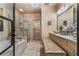 Well-lit bathroom with a walk-in shower, soaking tub, and vanity at 538 Sarabrook Ne Pl, Sandy Springs, GA 30342