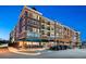 Multi-story building featuring retail spaces with shops and restaurants at street level and apartments above at 538 Sarabrook Ne Pl, Sandy Springs, GA 30342