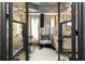 Elegant main bedroom with dark wood floors, chandelier, and French doors at 538 Sarabrook Ne Pl, Sandy Springs, GA 30342