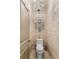 Stylish powder room with chandelier lighting, and paneled accent wall at 538 Sarabrook Ne Pl, Sandy Springs, GA 30342