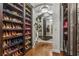 Well-organized closet with mirrored walls and custom shoe racks at 538 Sarabrook Ne Pl, Sandy Springs, GA 30342