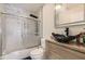 Modern bathroom featuring a vessel sink, a toilet, and a glass-enclosed shower over a tub at 775 Welch Sw St, Atlanta, GA 30310