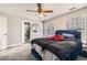 Bedroom with ensuite bath featuring ceiling fan, carpeted floor and view of the outdoors at 775 Welch Sw St, Atlanta, GA 30310