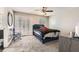 Bedroom with carpeted floor, ceiling fan and view of the outdoors from the french doors at 775 Welch Sw St, Atlanta, GA 30310