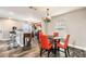 Dining area with hardwood floors adjacent to the kitchen, features a table with seating for four at 775 Welch Sw St, Atlanta, GA 30310