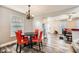 Dining area open to living room featuring stylish light fixture and hardwood floors at 775 Welch Sw St, Atlanta, GA 30310