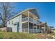 Charming two-story home with a double-decker porch and blue siding at 775 Welch Sw St, Atlanta, GA 30310