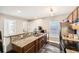 Well-lit kitchen featuring wood cabinets, granite countertops, and stainless steel appliances at 775 Welch Sw St, Atlanta, GA 30310