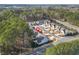 An aerial view displays the home's setting in a tree-lined neighborhood, offering a blend of community and natural beauty at 1078 Amarose Ln, Marietta, GA 30066